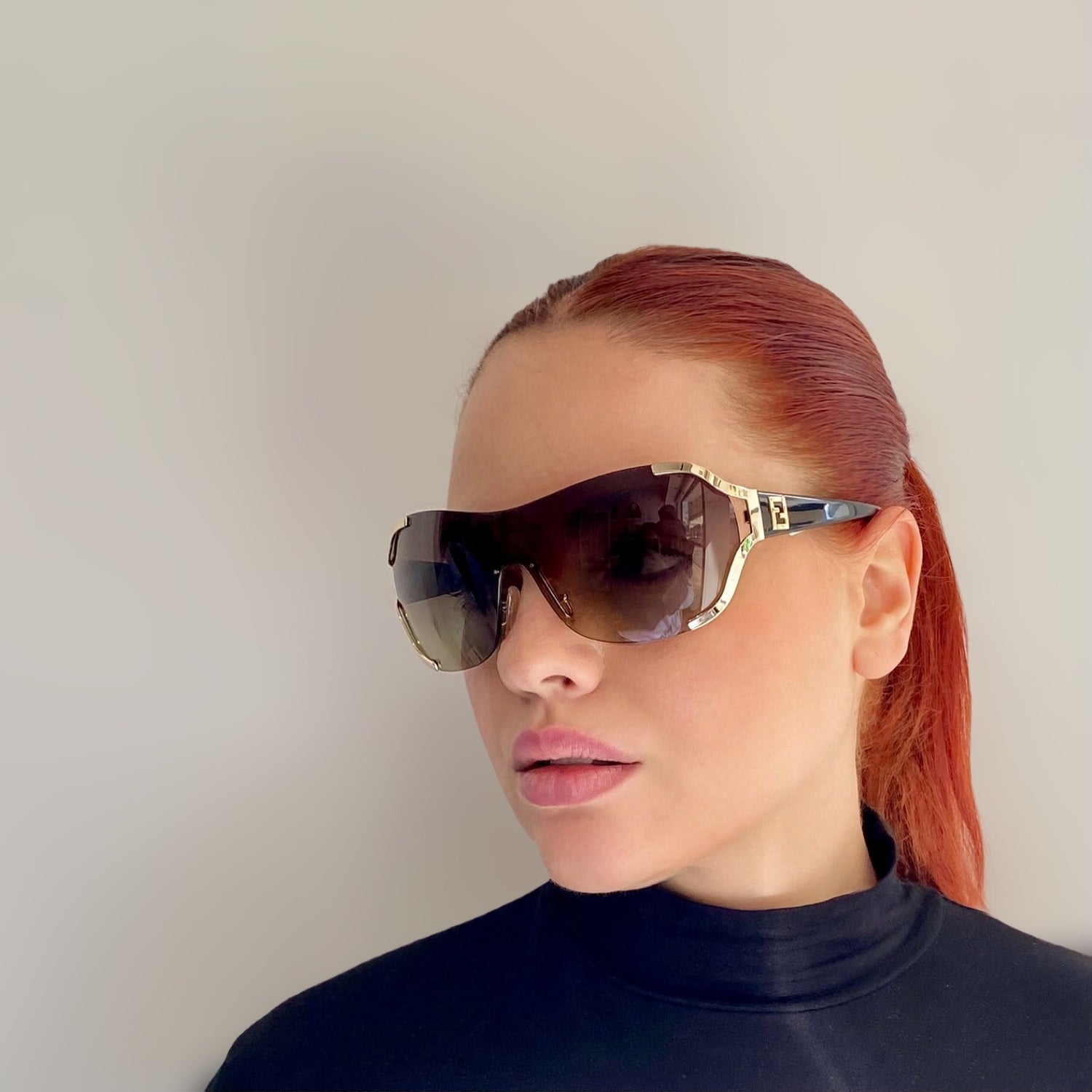 Pre-Loved Fendi Sunglasses- Black and Gold